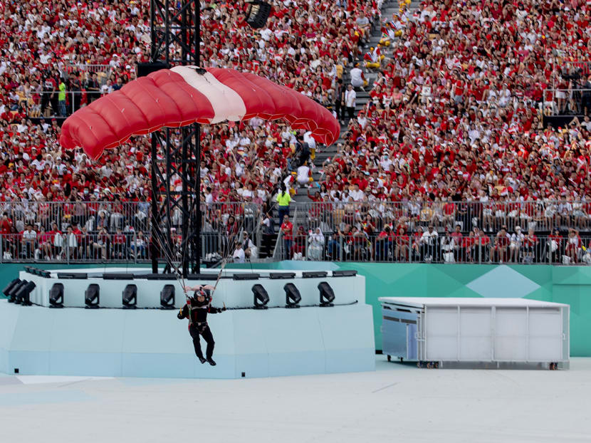 Spectators cheer for the Red Lions at the Padang during the National Day Parade on Aug 9, 2023. Spectators cheer for the Red Lions at the Padang during the National Day Parade on Aug 9, 2023.