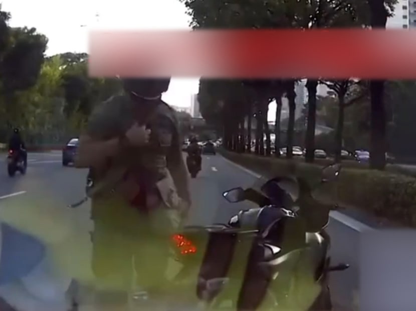 A screengrab of the motorcyclist caught on video claiming to be from the military police. A screengrab of the motorcyclist caught on video claiming to be from the military police.