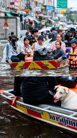 Bangkok residents navigate streets by boat as floods reach disaster level