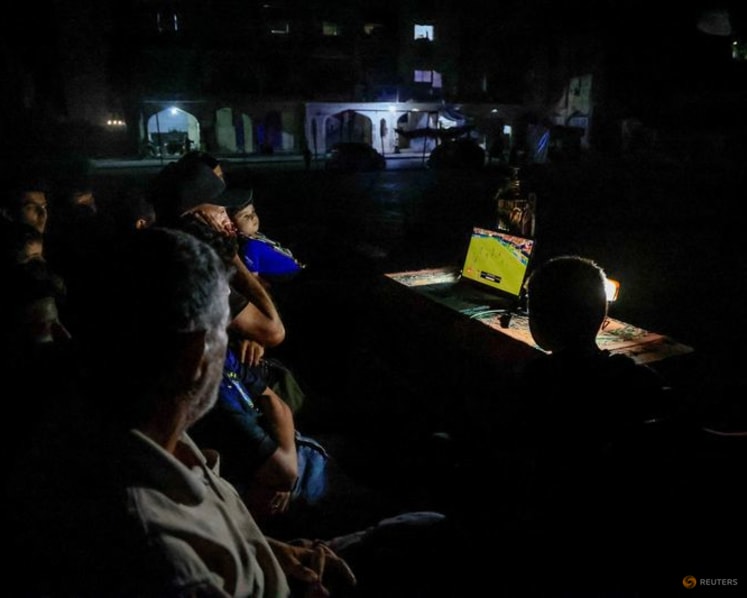 Gazans displaced by war watch World Cup from the ruins