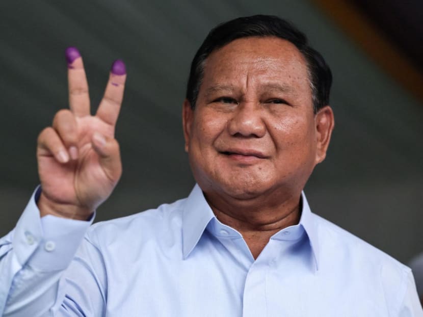 Indonesia's presidential candidate Prabowo Subianto gestures after he cast his ballot to vote in the country’s presidential and legislative elections at a polling station in Bogor on Feb 14, 2024.