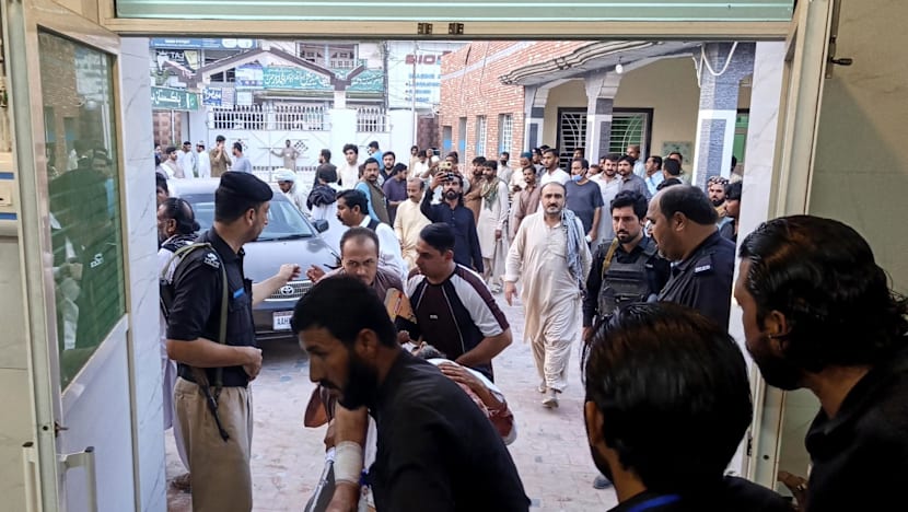 Gunmen target ambulance in Pakistan after suicide bombing at checkpoint killed 12