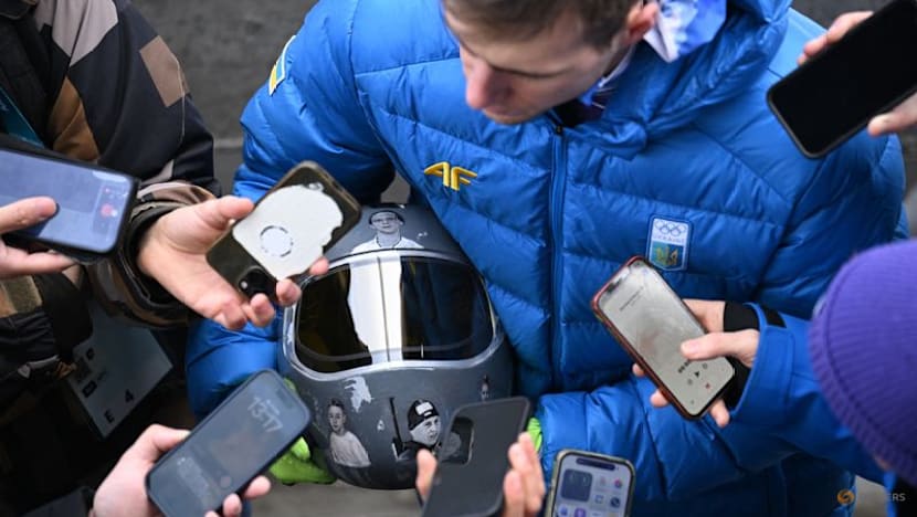 IOC 'begs' defiant Ukrainian to race without war dead helmet