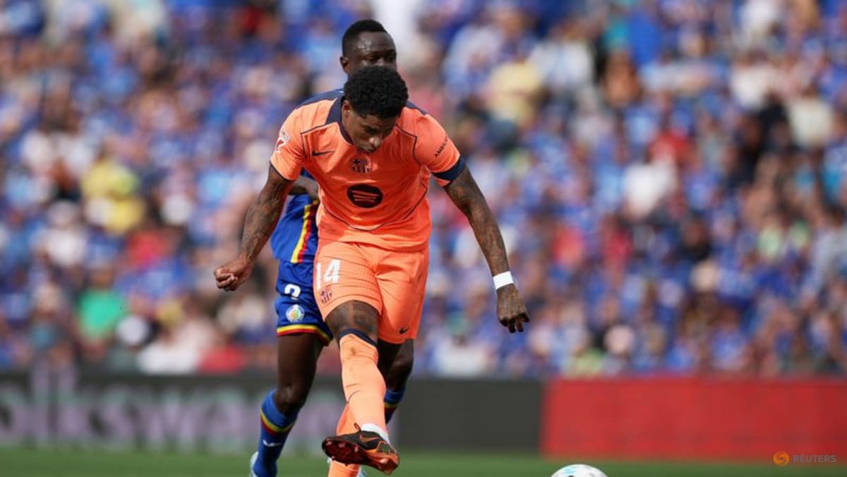 Barcelona march on towards title with 2-0 victory at Getafe