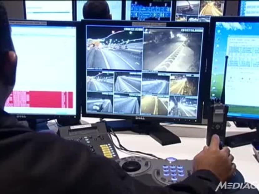 A Land Transport Authority (LTA) staff member monitors traffic at the KPE/MCE Operations Control Centre. Photo: Channel NewsAsia