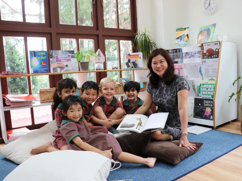 EtonHouse International Education Group founder and managing director Ng Gim Choo pictured with preschool children at one of the group's facilities.