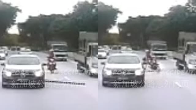 摩托车骑士快速公路遭木板绊倒