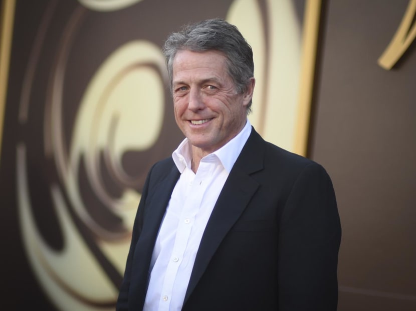 Hugh Grant says he got 'enormous sum' to settle suit alleging illegal snooping by The Sun tabloid