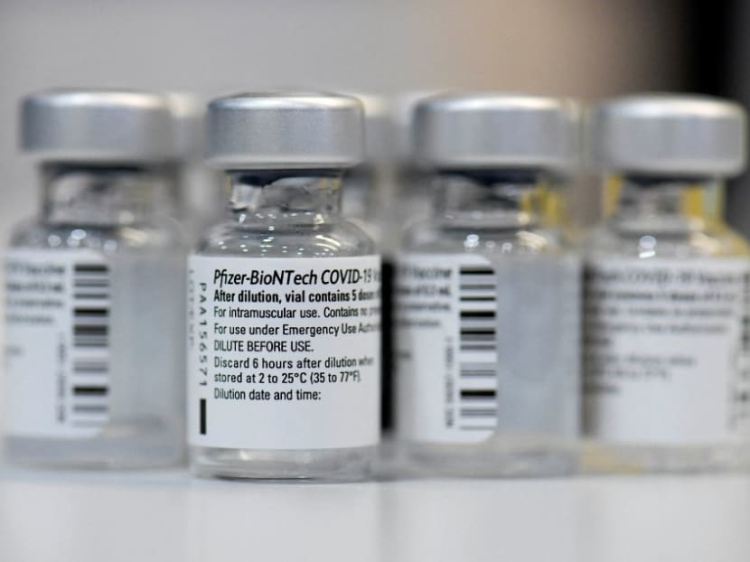 In this file photograph taken on Jan 22, 2021, empty vials of the Pfizer-BioNTech Covid-19 disease vaccine are displayed at the regional corona vaccination centre in Ludwigsburg, southern Germany.
