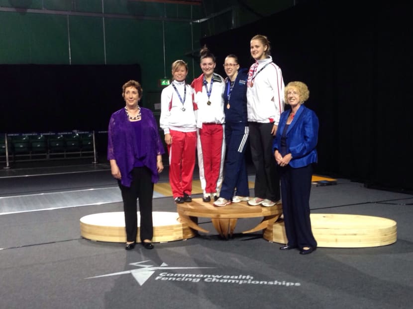 Singapore's Ann Lee (left) on the winners' podium after bagging silver in the women's individual sabre at the Commonwealth Championships 2014. Photo: Fencing Singapore