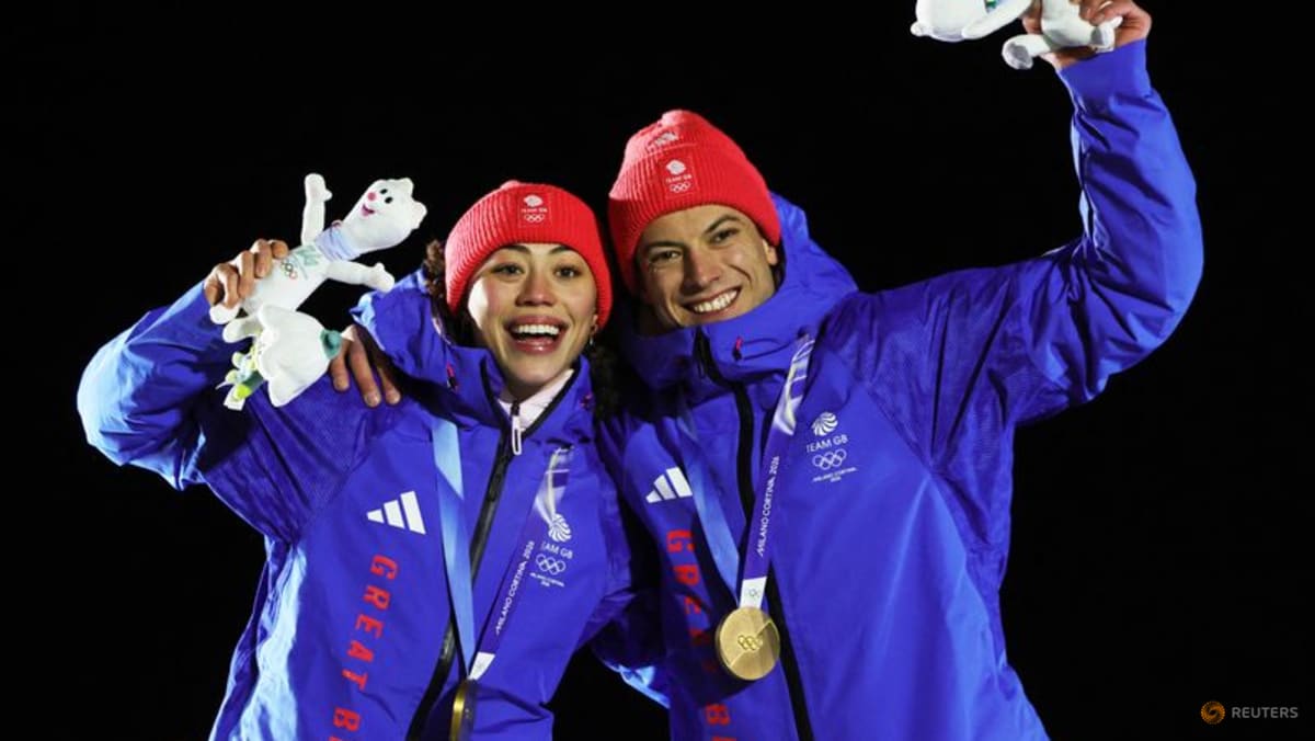 Britain celebrates 'Slippery Sunday' double gold