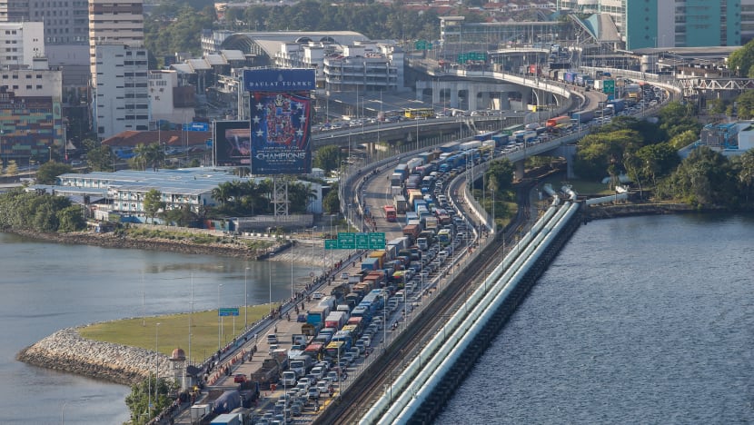 Flow of goods, cargo and food supplies between S’pore and M’sia to continue during M’sian lockdown: PM Lee