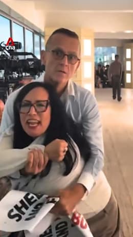Fashion exec grabs PETA protester at New York Fashion Week