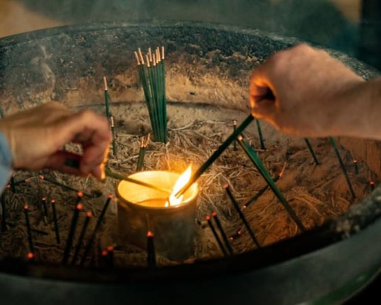 Woman faces charges of making child burn himself with joss stick, cut himself