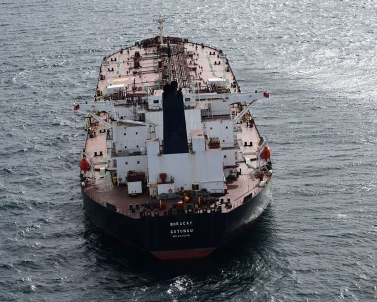 Oil up as investors balance sanctions risks, oversupply worries