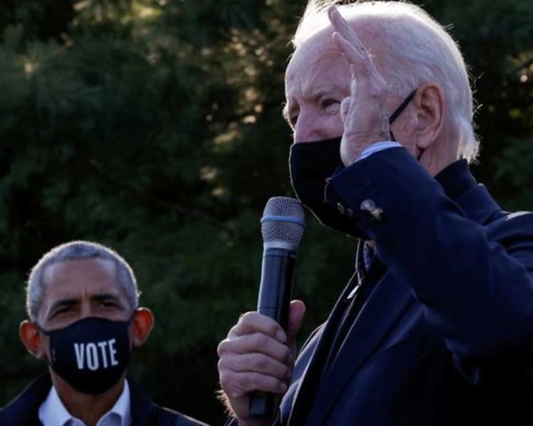 Biden turns to Obama to help boost health care enrollment