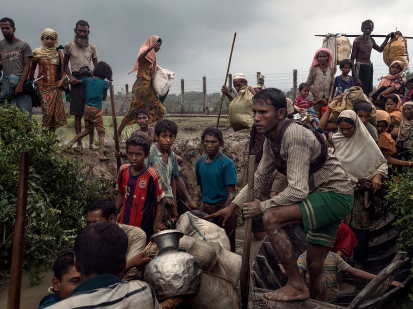 Rohingya refugees waiting to board boats to Bangladesh on the bank of the Naf River in Myanmar last September. The inquiry to probe allegations of human rights abuses in the conflict-torn Rakhine state will only progress if the army cooperates with it. And this is far from certain.