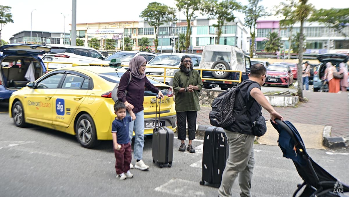 Passengers, cabbies welcome relaxation of rules for cross-border taxis