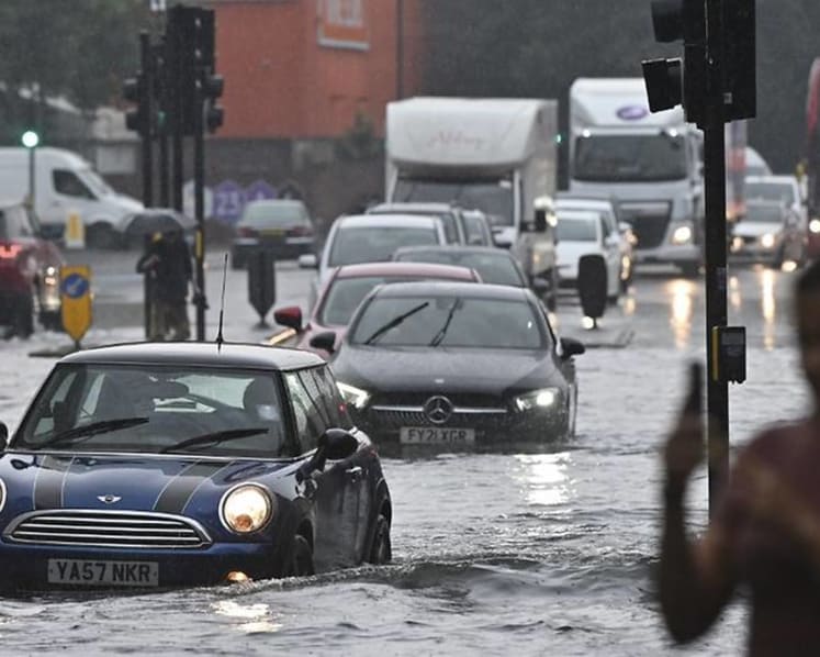 London cleans up after flash flooding drenches homes, subway