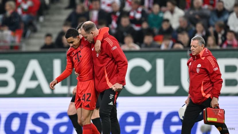 Bayern battle past 10-man Augsburg but Musiala goes off injured
