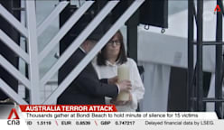 Thousands gather at Sydney’s Bondi Beach to hold minute of silence for victims of last week’s attack