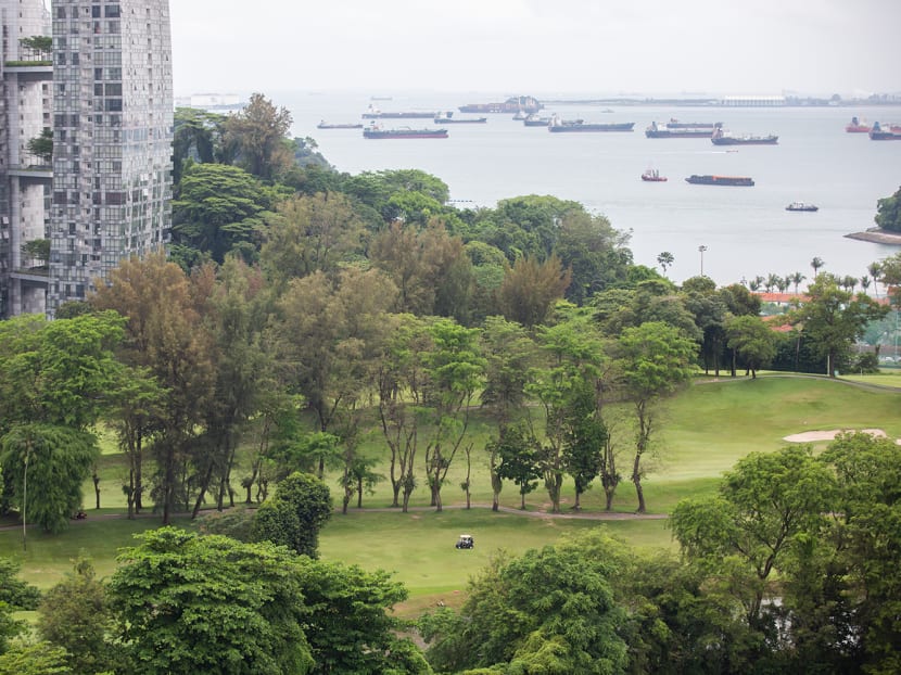 A view of part of Keppel Club's golf course facing the waters of Singapore Strait, with a tower block from Reflections at Keppel Bay condominium estate on the left. A view of part of Keppel Club's golf course facing the waters of Singapore Strait, with a tower block from Reflections at Keppel Bay condominium estate on the left.