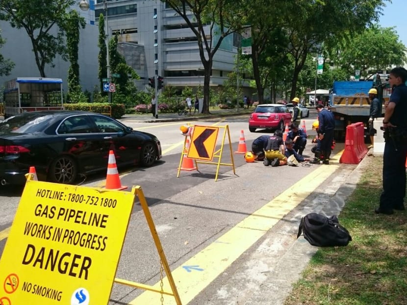 The Singapore Civil Defence Force was alerted to a fire coming out of a manhole at the junction of High Street and Hill Street around 7.30am this morning (April 2). Photo: Kelly Ng
