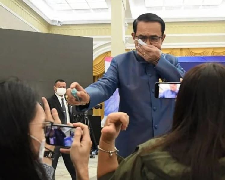 Thai prime minister sprays reporters with disinfectant
