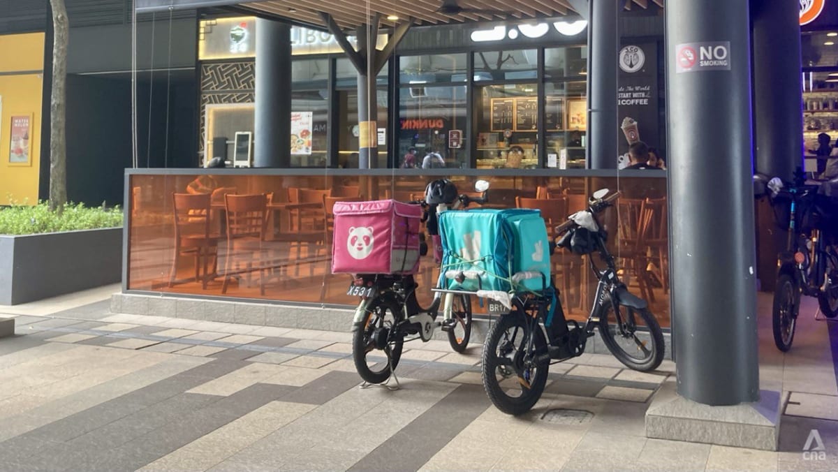 4 foreigners charged for working illegally as food delivery riders - CNA
