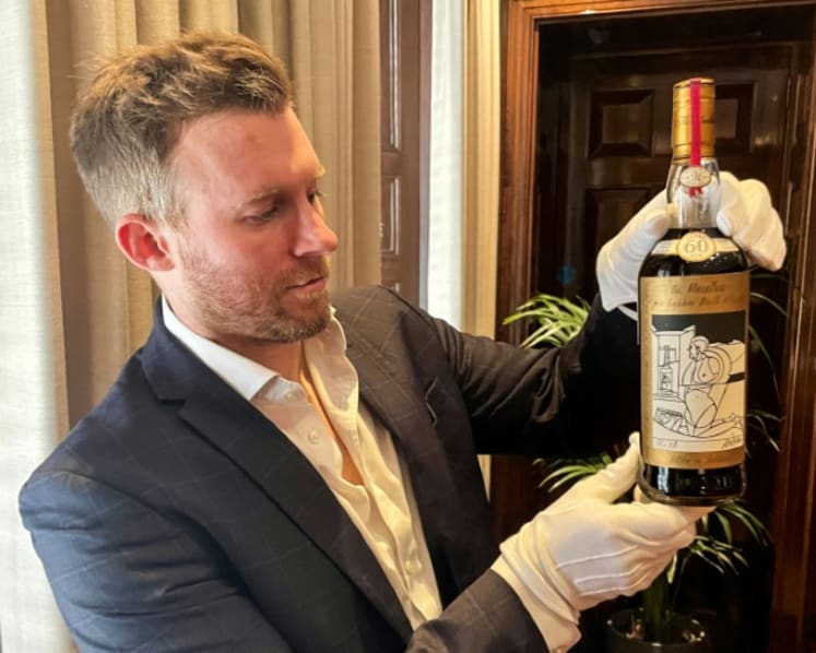 Cheers! Bottle of Scotch whisky sells for a record US$2.7 million at auction