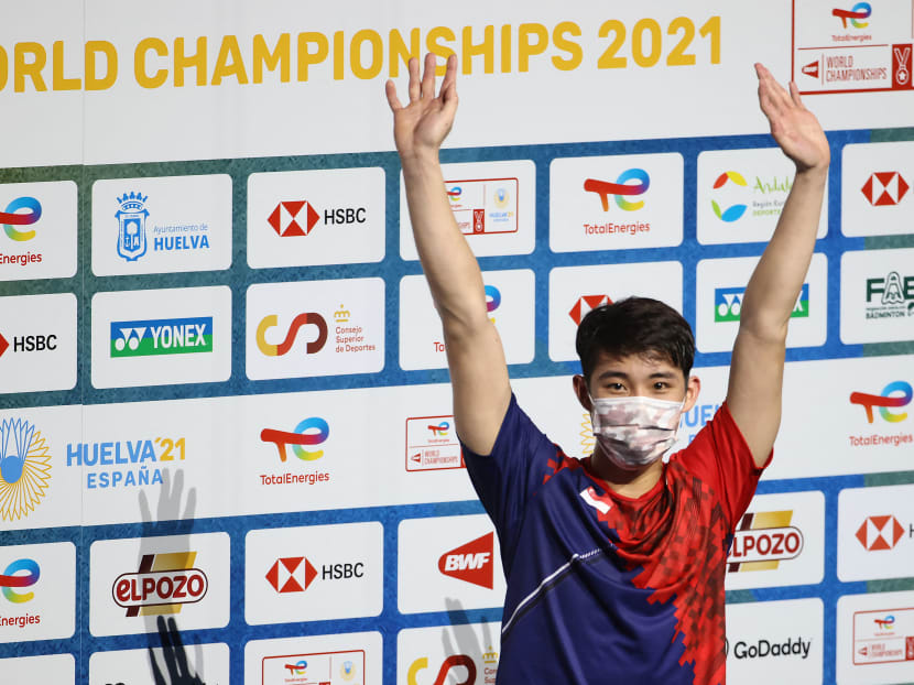 Singapore's Loh Kean Yew celebrates on the podium after winning the men's singles final badminton match of the BWF World Championships in Huelva, Spain, on Dec 19, 2021.
Singapore's Loh Kean Yew celebrates on the podium after winning the men's singles final badminton match of the BWF World Championships in Huelva, Spain, on Dec 19, 2021.