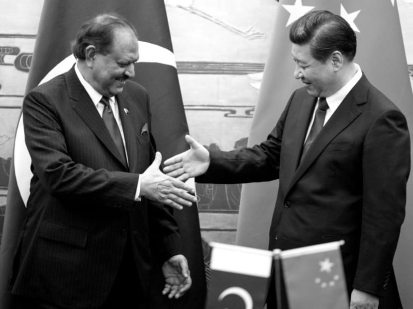 Pakistani President Mamnoon Hussain (left) with Chinese President Xi Jinping. One of the first countries to recognise the People’s Republic in the 1950s, Islamabad was a bridge between China and the US.  PHOTO: REUTERS