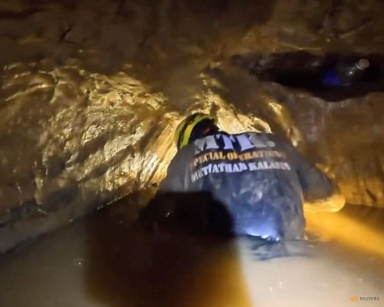 'It’s like diving into coffee': Rescuers in Laos describe risky mission to free men trapped in cave