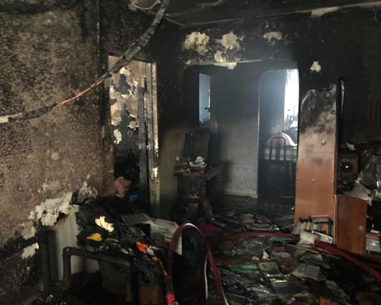 Fire at Woodlands flat caused by PMD left charging; teenager and firefighter suffer burns