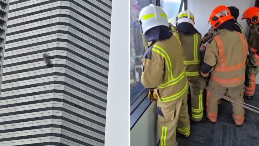 workers_rescue_gondola_raffles_city_tower.png