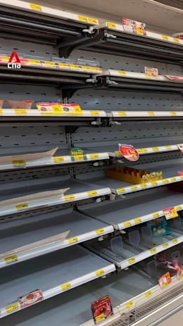 Empty shelves, snaking queues as Bangkok braces for prolonged flooding