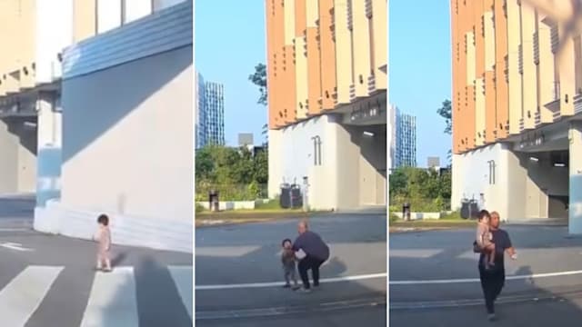 开车目睹落单幼童冲向马路 热心司机及时抱起