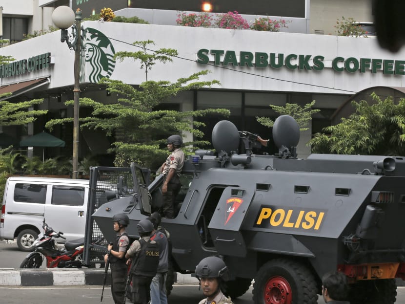 Seven dead in Jakarta blasts, gunfight