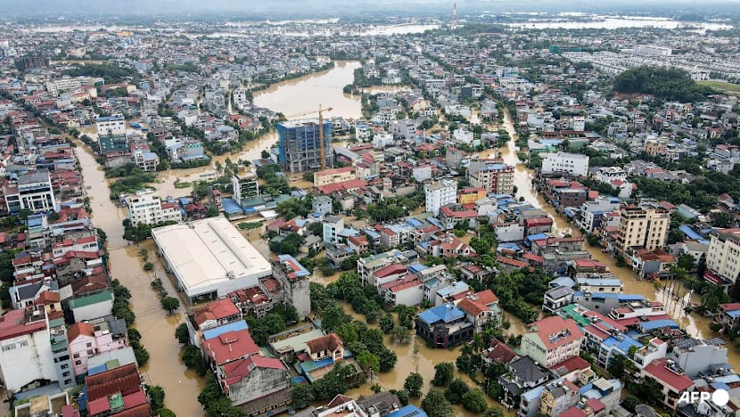 Thousands stranded as record floods submerge Vietnam streets