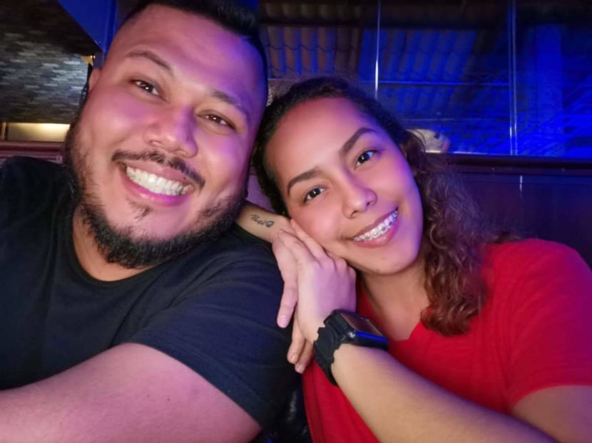 Mr Andrew Fernandez and his fiancee, Ms Christine Joy Otis, who is about to give birth. He will be missing the birth of his child.
