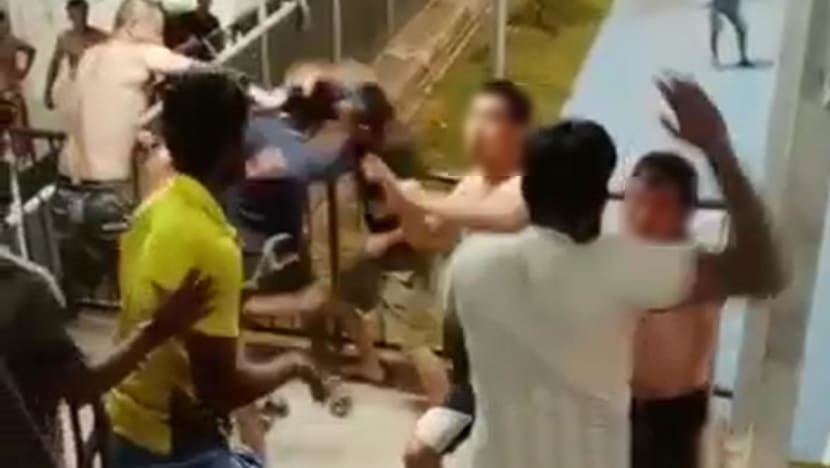 9 men helping with police probe into rioting case at Changi migrant workers’ dorm