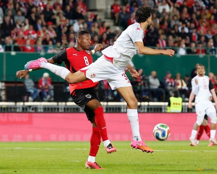 Austria fight back from early red card to beat Tunisia