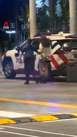 2 arrested at MBS for allegedly scamming man into making multiple bank transfers