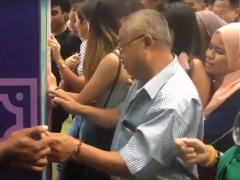 Local telecommunications company Circles.Life is the company behind a publicity stunt that gave out “free money” in the heart of the Central Business District on Wednesday. Screengrab: Channel News Asia