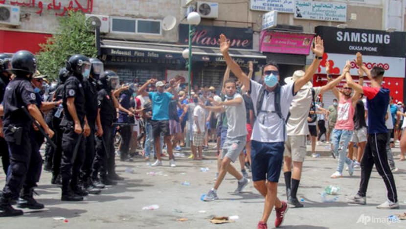 Tunisian president fires premier after violent protests