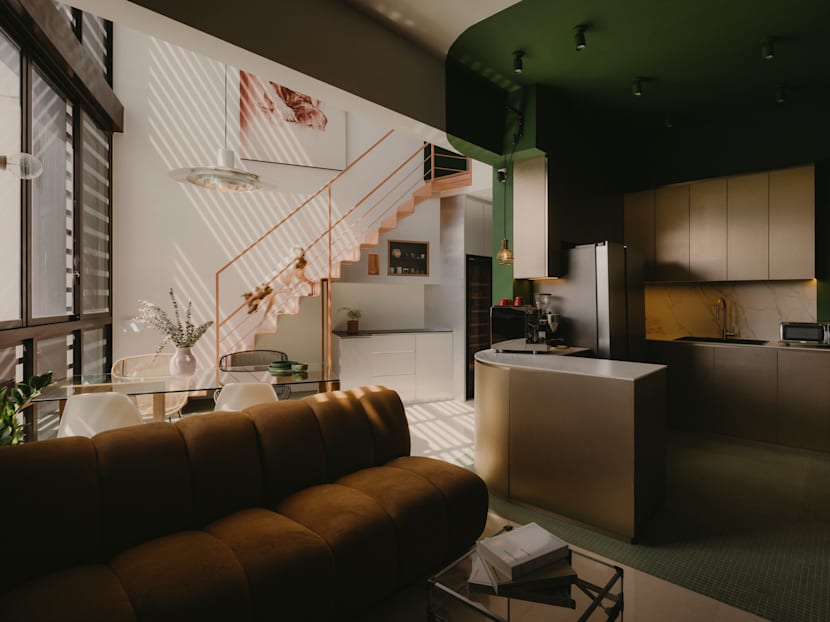 Colour blocking and artworks bring personality to this Singapore home