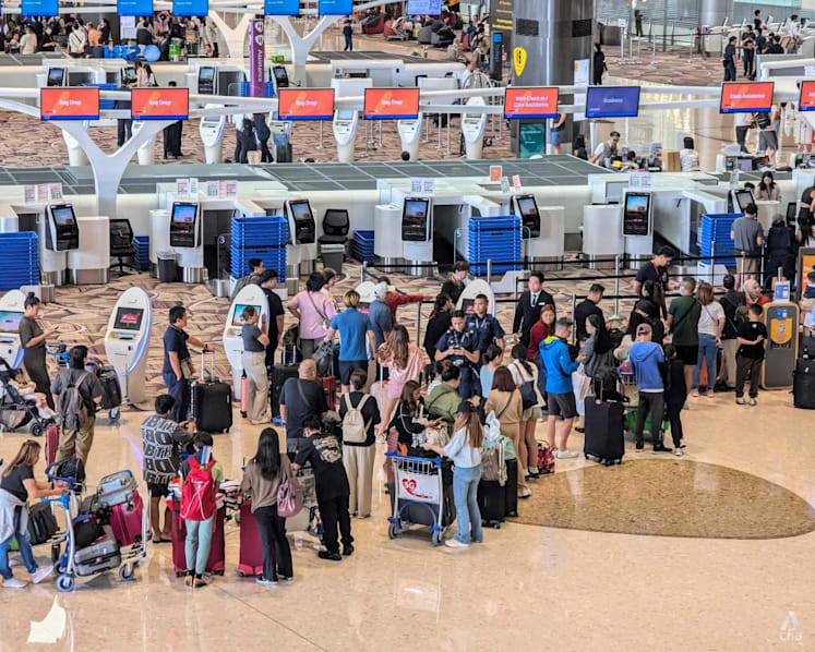 Long queues, frustrated passengers at Changi Airport after some airlines' systems go down in global IT glitch 