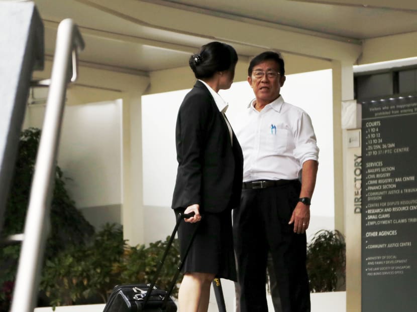 Veteran athletics coach Loh Siang Piow, 73 (R) is seen outside The State Courts, Jan 22, 2018. Photo: Raj Nadarajan/TODAY