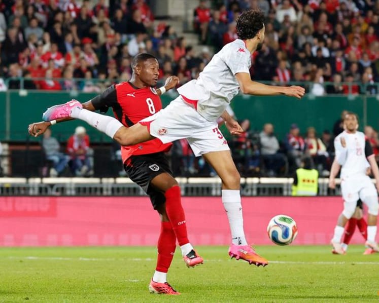Austria fight back from early red card to beat Tunisia