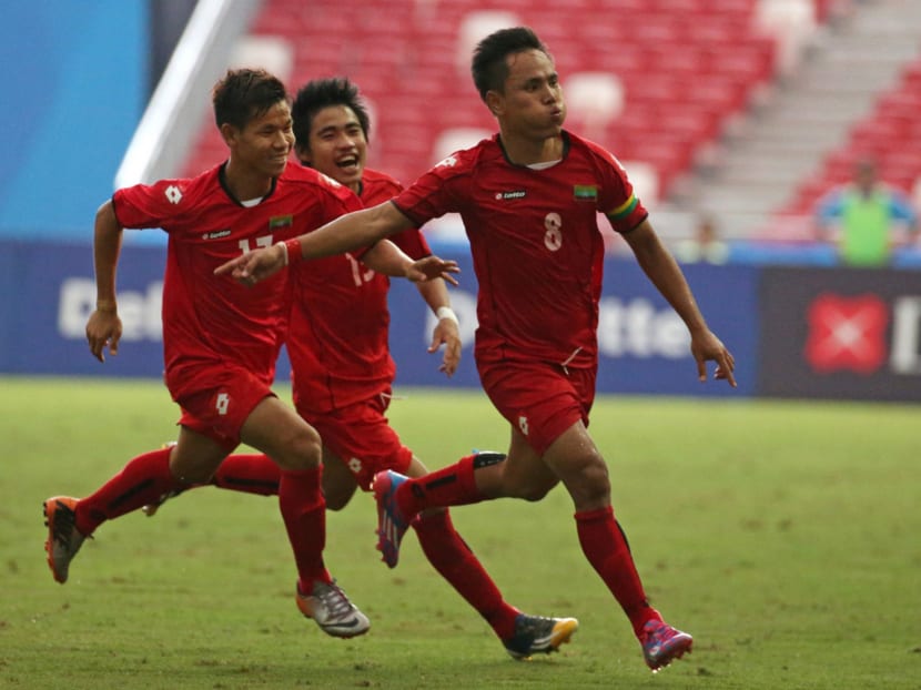 Myanmar's Tun Nay Lim (right) celebrates his goal against Vietnam. Photo: SINGSOC / Action Images via Reuters